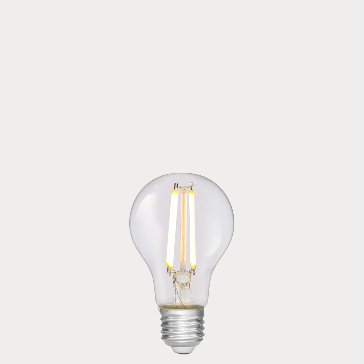 Dulora 6.5W GLS LED Bulb E27 Clear in Soft White glowing with crisp neutral light through clear A60 glass