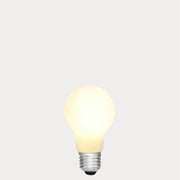 Dulora 11W E27 LED GLS bulb in frosted glass, glowing with 3000K soft white light.