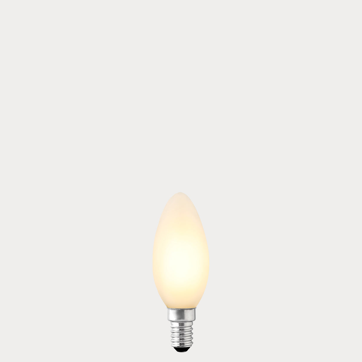 Dulora 4.2W Candle LED Bulb E14 Porcelain in Warm White, glowing with 2700K warm white light.