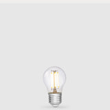 Dulora 4W 12-24 Volt AC/DC Fancy Round LED Bulb E27 in Warm White illuminated with warm light through clear round glass