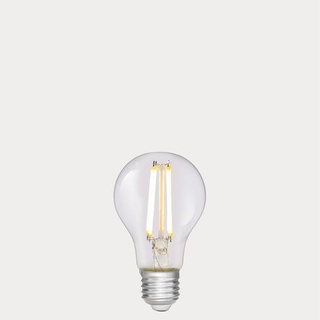 Dulora 6.5W GLS LED Bulb E27 Clear in Soft White glowing with crisp neutral light through clear A60 glass